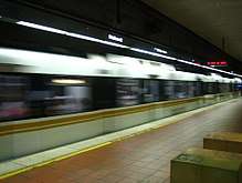 A Blue Line train enters 7th Street/Metro Center, its terminus.