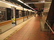 A Blue Line train is stationed on the B1 level of 7th Street/Metro Center Station, its terminus.