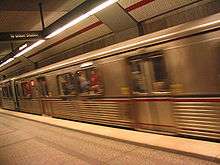 A subway train arrives at Wilshire/Vermont station.