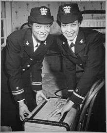 Pictured are Lieutenant Harriet Ida Pickens and Ensign Frances Wills, the first African-American women to be commissioned in the WAVES. They are shown bending over a suitcase. The photograph was taken on 21 December 1944.