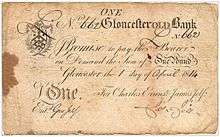 Old piece of paper money with the inscription in script-appearing text