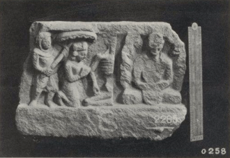Relief with monk meditating at the right, and and on the left, half of a skeleton, a kneeling crowned figure and a second figure holding a parasol above the crowned figure