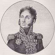 Black and white print of a man with mutton chops, round eyes and wavy hair. He wears a high-collared military uniform with much braid.