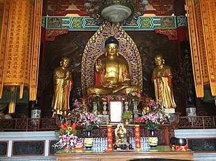 Temple with Buddha image, flanked by Ānanda and Mahākassapa