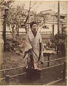 Japanese Woman in Traditional Dress Posing Outdoors ca. 1870s.