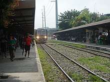 This train is bound for Tutuban is about to leave Santa Mesa station.