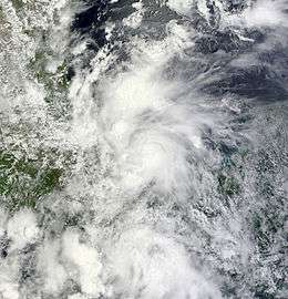 A visible satellite image of a tropical depression nearing tropical storm intensity in the Bay of Campeche.
