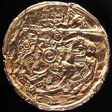 Colour photograph showing the gold Pliezhausen bracteate, which depicts a scene nearly identical to design 2.