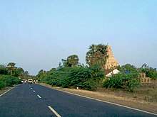 image of a road with the temple on the right side