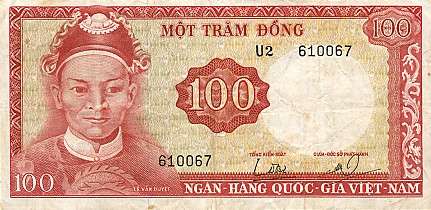 A light-coloured rectangular paper banknote with a red foreground. A young-looking, unwrinkled, clean-shaven round-headed man with an ornamental headpiece and his shoulders are visible to the left. "100" appears to the centre in a red ring. A red border is present.
