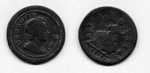 both sides of a small copper coin (the farthing) with a man's head on one side and Britannia on the other