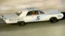 White Chrysler Turbine Car with a number on its side