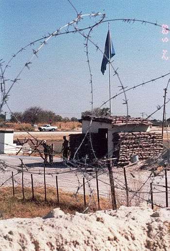 Photograph of the front entrance to the Australian base at Ondangwa from inside the wire