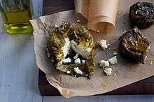 A The Greek Kiss, a grape-leaf wrapped disc of Belle Chevre.