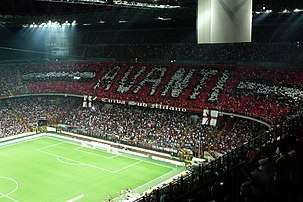 The San Siro stadium, filled to capacity, during a match between AC Milan and Inter Milan.