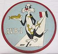 A This insignia was adopted in 1960. It features Sylvester the Cat wearing devices representing the three categories of naval personnel which make up the crew of an AVB: aviation, line, and Seabees. This ship's mission is represented by the runway, which emanates from two doors, symbolizing the bow doors of the ship. The colors on the doors are those of Italy where Alameda County is home ported. The runway markings represent the year (1957) in which this ship was designed AVB-1. Permission to use this copyrighted character was granted by Warner Brothers.