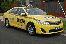 Yellow Toyota taxi