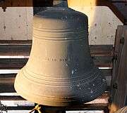 This is an image of the 6th Bell in the Highland Arts Theatre Chime, showing the inscription "STRENGTH AND BEAUTY ARE IN HIS SANCTUARY." from Psalm 96:6 - Honour and majesty are before him: strength and beauty are in his sanctuary. This bell rings a C&#x266f; and weighs 650 lb (290 kg).