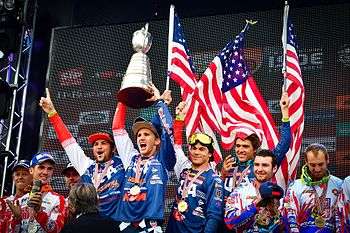 (Left–Right) Americans Thad Duvall, Taylor Robert, Kailub Russell and Layne Michael hoist the ISDE trophy over their heads for the first time at the 91st running of the ISDE.