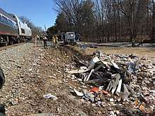 Aftermath of the crash with the trash strewn about the accident site.