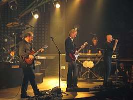 Genesis onstage performing
