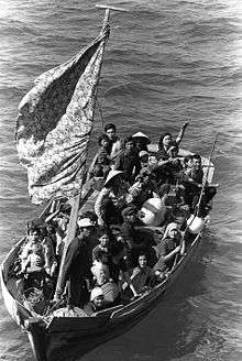 Refugees crowded together on a boat