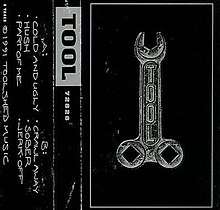 Cover art for 72826, featuring a phallic wrench on the front, and a track listing on the back