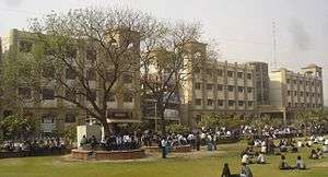 The main building of ABES Engineering College, called as Aryabhatta block. The front lawn with students can also be seen in the front