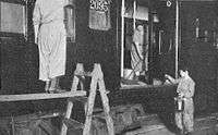 Women in a car shop clean and repaint an AB Standard c. 1917–1918