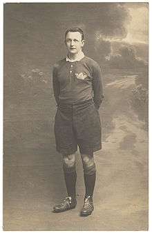 full body shot of Johnnie Wallace wearing his playing strip and boots