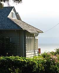 Photograph of a house overlooking the ocean