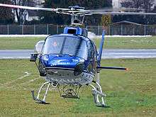 A Eurocopter AS350 helicopter with a belly hook installed.