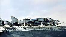 several Harriers stored on board a ship