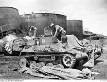 Soldiers inspect disused armoured vehicles