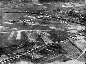 a black and white aerial photograph with markings showing key features