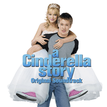 A young blonde girl carried on the back of a young brown-haired man. The girl is wearing a white tiara, white ball gown, and pink tennis shoes; the boy wears a gray shirt with black sleeves, and blue jeans. On their image, the words "A Cinderella Story" and "Original Soundtrack" are written in blue, bold font.