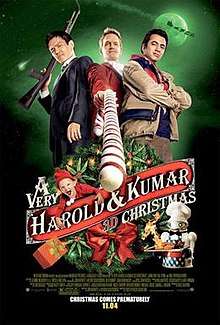 Two men stand on either side of Neil Patrick Harris holding a candy cane like a gun.