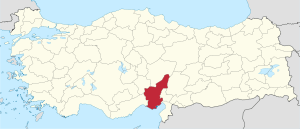 Adana highlighted in red on a beige political map of Turkeym