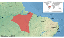 Map of northeastern Brazil, showing a highlighted range (in red) covering a roughly triangular area south of the lower reaches of the Amazon River