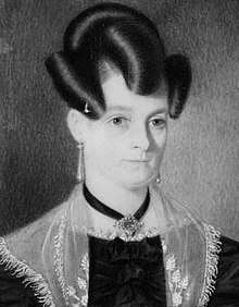 Photographic print of a painting of a woman with coiffed hair, wearing a formal black dress, satin (?) shawl, earrings and a necklace.