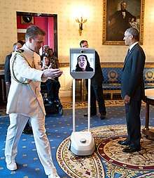 Alice Wong participated at the 25th anniversary of the Americans With Disabilities Act via robot in the White House