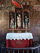 Altar with triptych and the hull of a votive ship