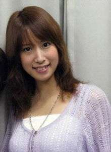 Voice actress Ami Koshimizu smiling in a photo taken at Waseda University in November 2008