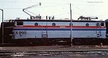 Silver locomotive with red and blue stripes