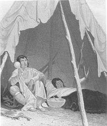 1857 engraving of a sick Native American being cared for by an indigenous healer