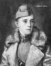 An artistic portrait of a young man in military uniform. He is wearing a cap and a large coat. The background has a dark shading and an aviators badge is in the top right corner.