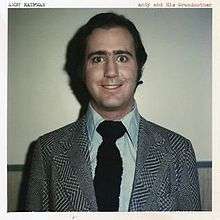 A Polaroid photograph of Kaufman smiling with the title of the album along the upper edge