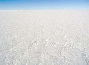 aerial view of ice sheet covered in snow Antartica