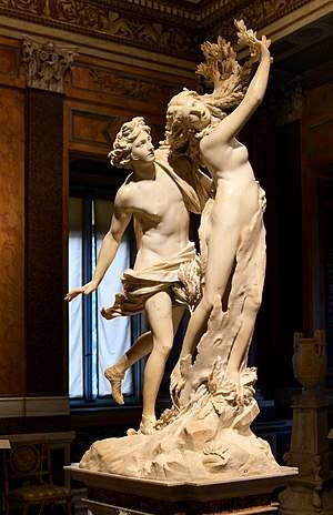 A photograph of the sculpture Apollo and Daphne, depicting one woman and one man.