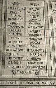 Photograph shows two columns of French names etched in stone.
